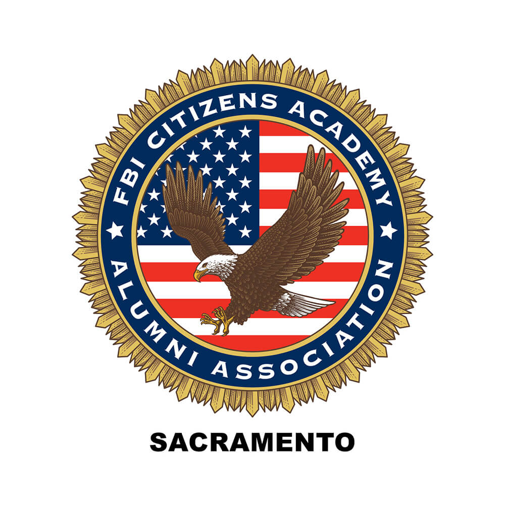 Graphic of a circular seal in gold, blue, and red. An eagle in flight is depicted in the middle against a field of the United States flag. Words around the seal say "FBI Citizens Academy Alumni Association", and underneath it says Sacramento.